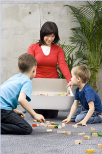 Picture of kids cleaning up toys